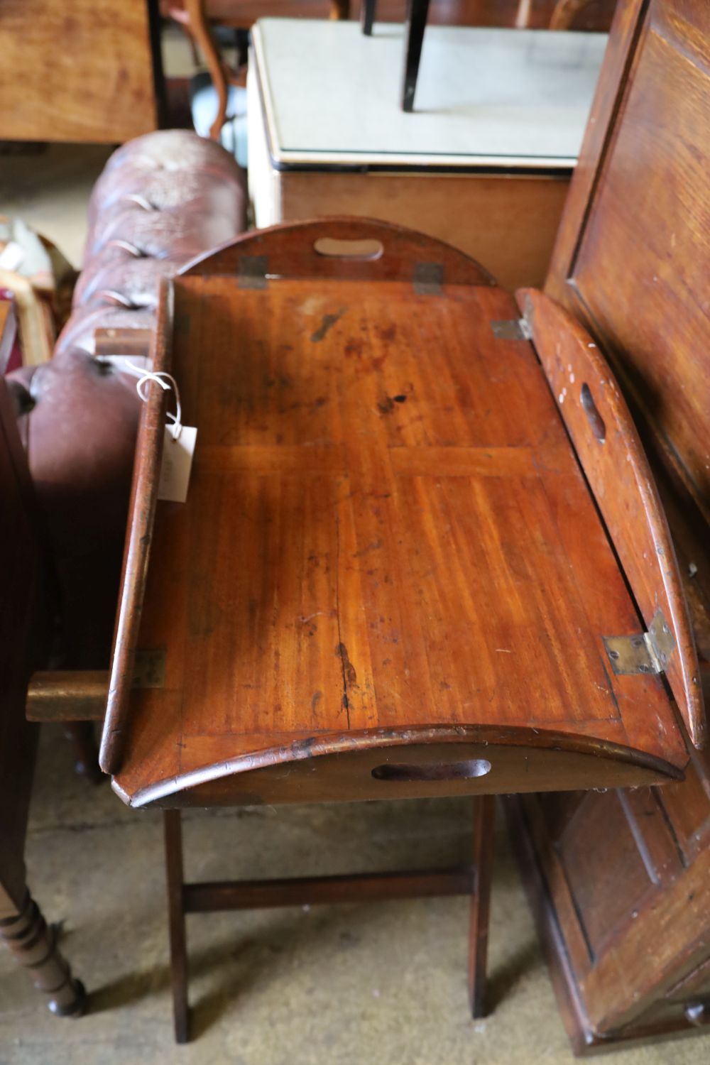 A George III mahogany folding butlers tray, with folding stand, width 86cm, depth 65cm, height 84cm